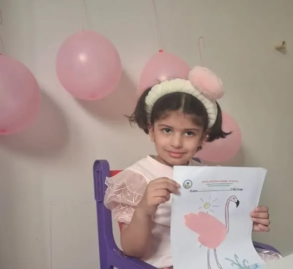 Nursery children dressed in pink.